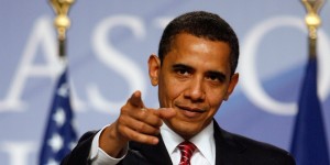 U.S. President Barack Obama points to a journalist at a news